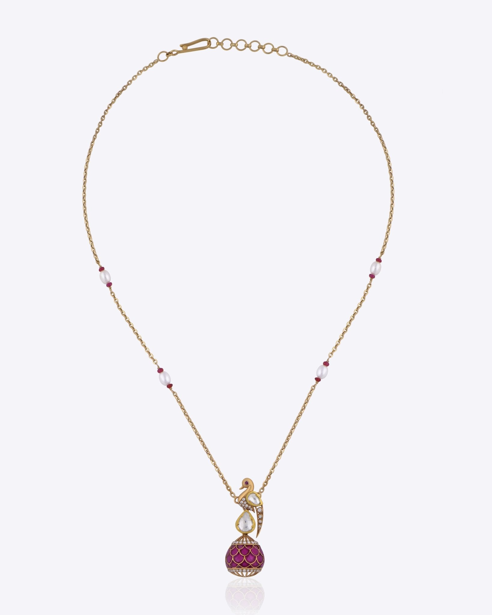 9K gold swan-inspired pendant with Polki diamonds and a pink-hued drop.