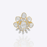 Gold floral ring with uncut diamond petal clusters around an oval center.