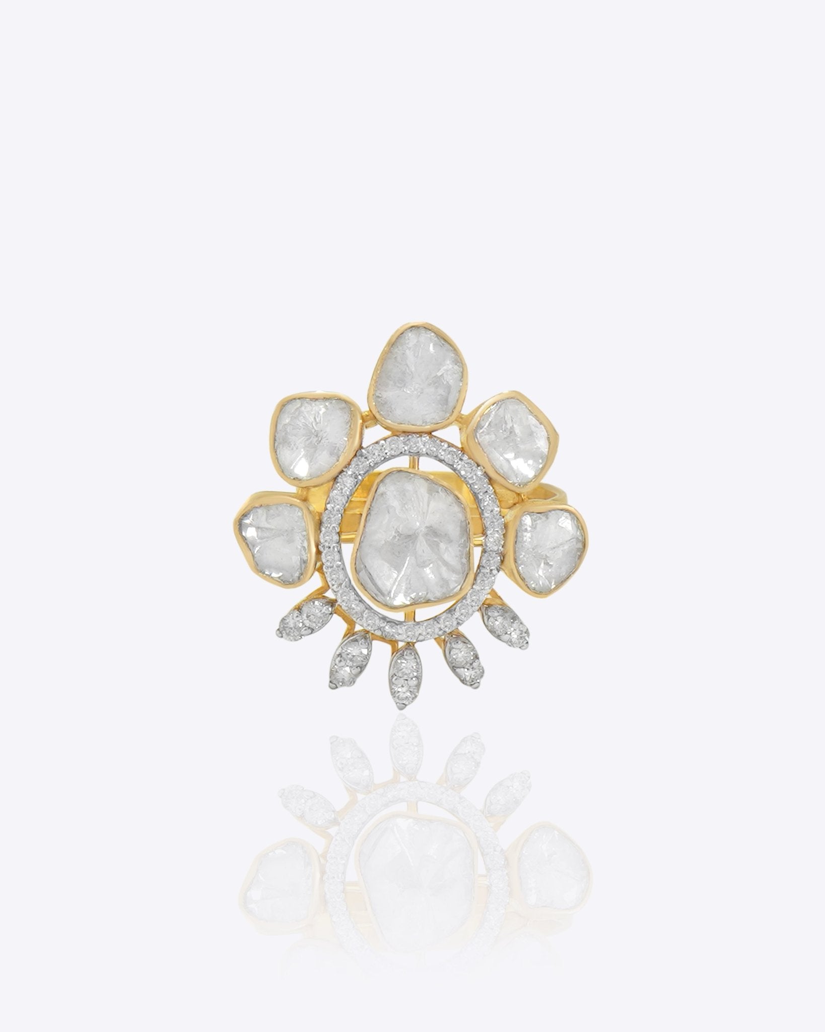 Gold floral ring with uncut diamond petal clusters around an oval center.