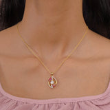 9K gold openwork sphere pendant with a central Polki uncut diamond.