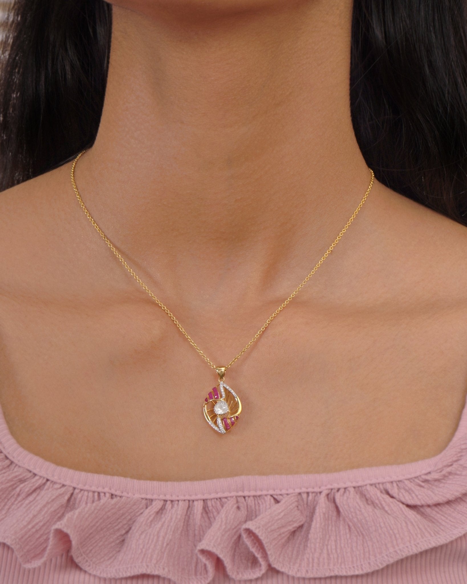 9K gold openwork sphere pendant with a central Polki uncut diamond.