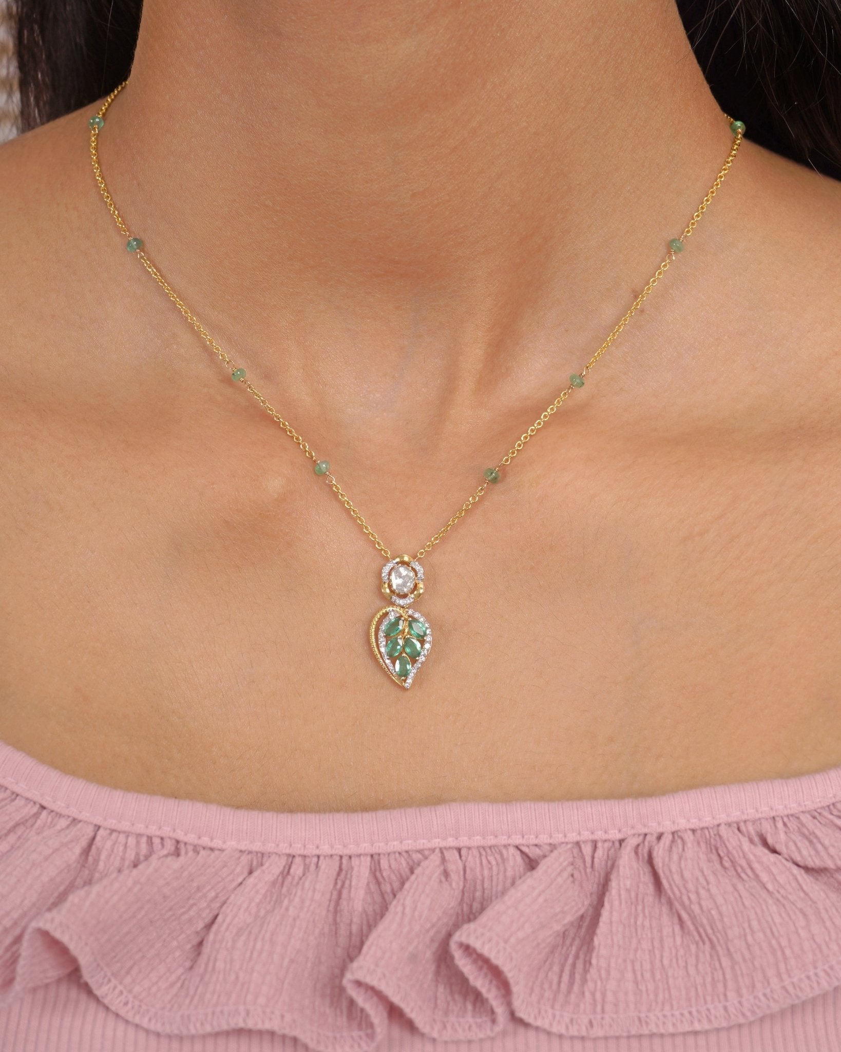 Teal Leaf Pendant in 9K gold with teal gemstone stations and a pear-cut teal drop.