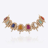Navratna choker with nine gemstones, Polki diamond framing, gold detailing and pearl drops