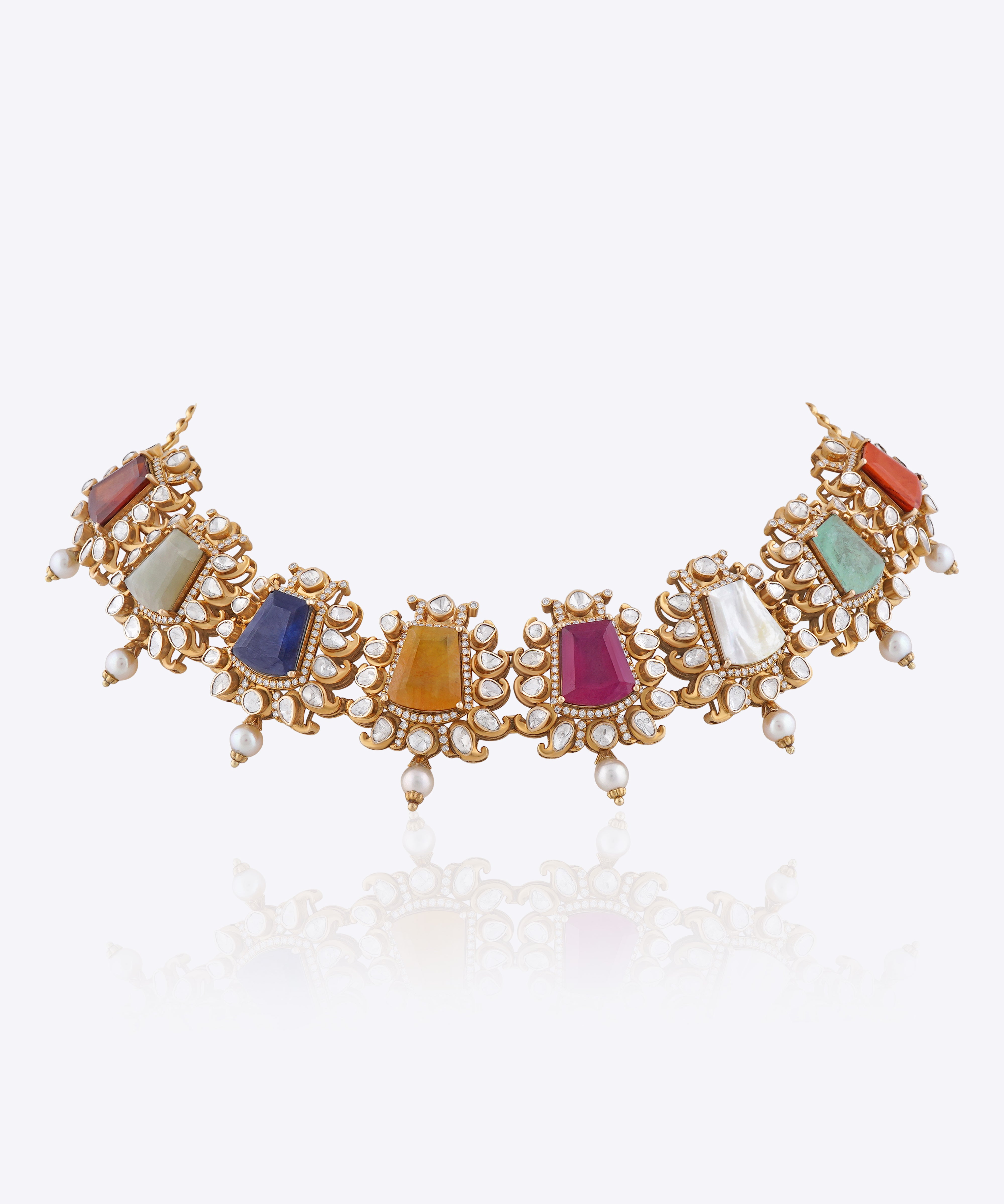 Navratna choker with nine gemstones, Polki diamond framing, gold detailing and pearl drops