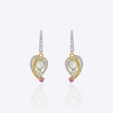 9K gold teardrop earrings with Polki detailing and delicate diamond accents.