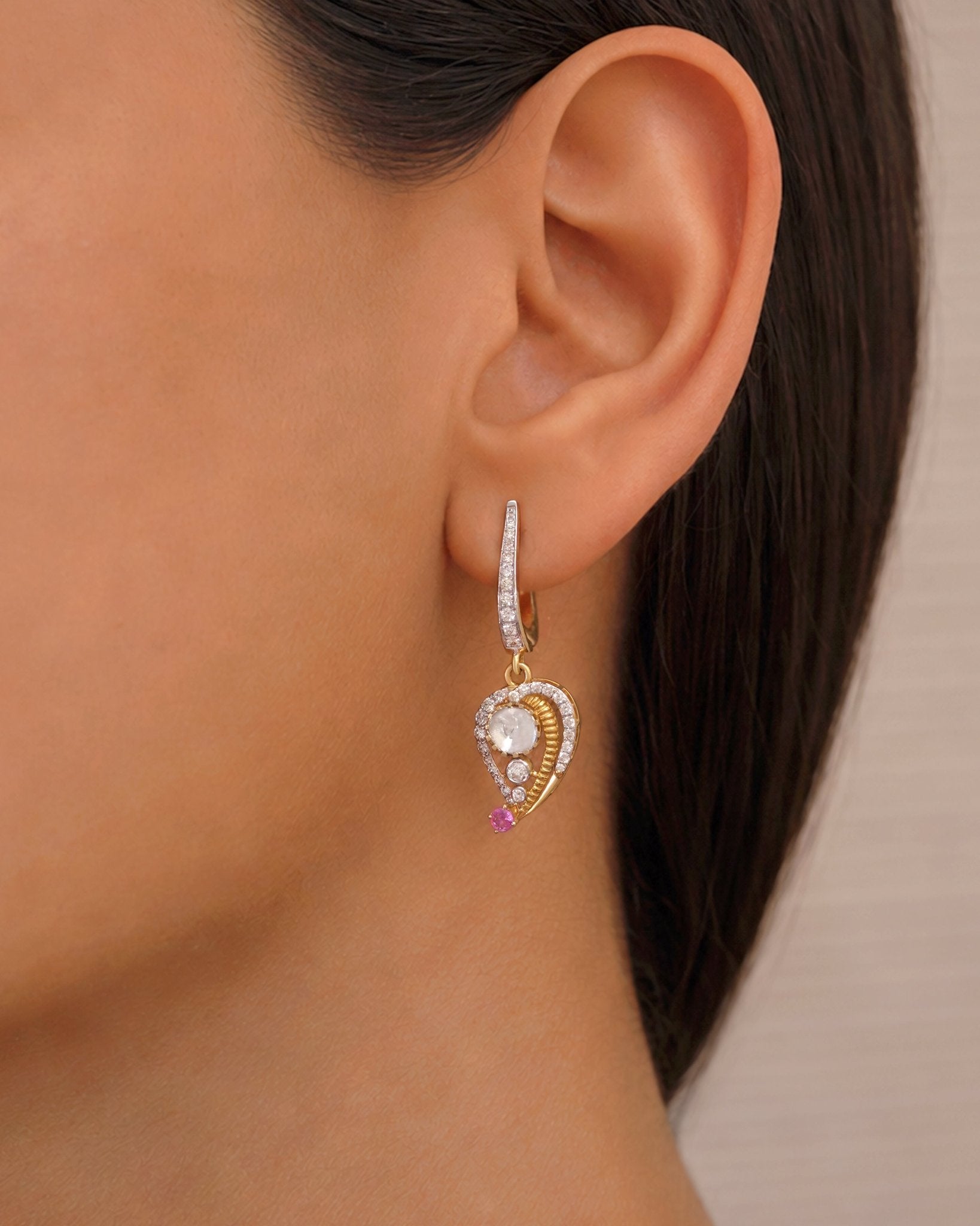 9K gold teardrop earrings with Polki detailing and delicate diamond accents.