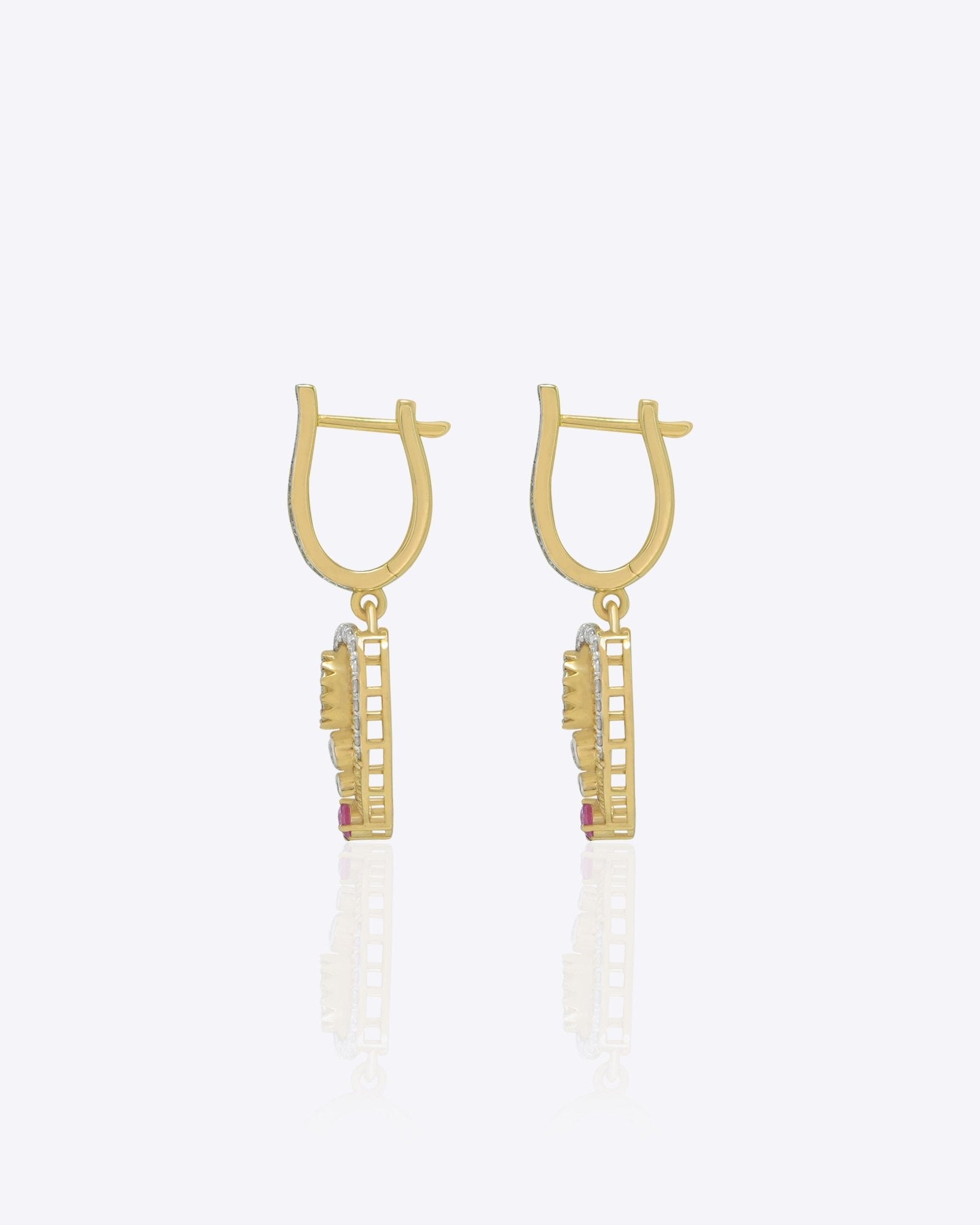 9K gold teardrop earrings with Polki detailing and delicate diamond accents.