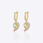 9K gold teardrop earrings with Polki detailing and delicate diamond accents.