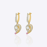 9K gold teardrop earrings with Polki detailing and delicate diamond accents.