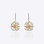 9K gold drop earrings with uncut diamonds and a pink gemstone center