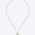Teal Leaf Pendant in 9K gold with teal gemstone stations and a pear-cut teal drop.