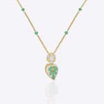 Teal Leaf Pendant in 9K gold with teal gemstone stations and a pear-cut teal drop.