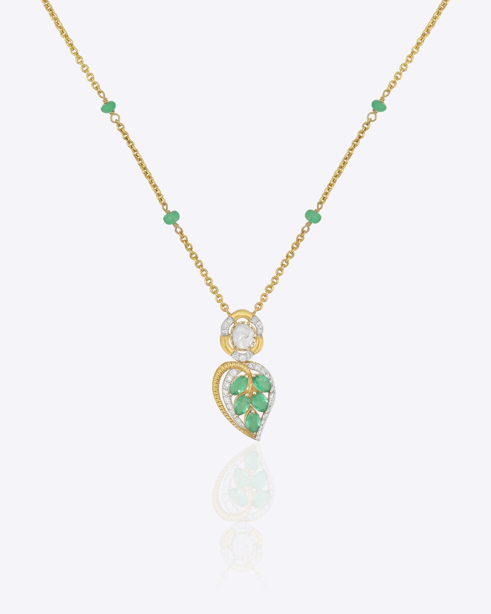 Teal Leaf Pendant in 9K gold with teal gemstone stations and a pear-cut teal drop.