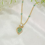 Teal Leaf Pendant in 9K gold with teal gemstone stations and a pear-cut teal drop.