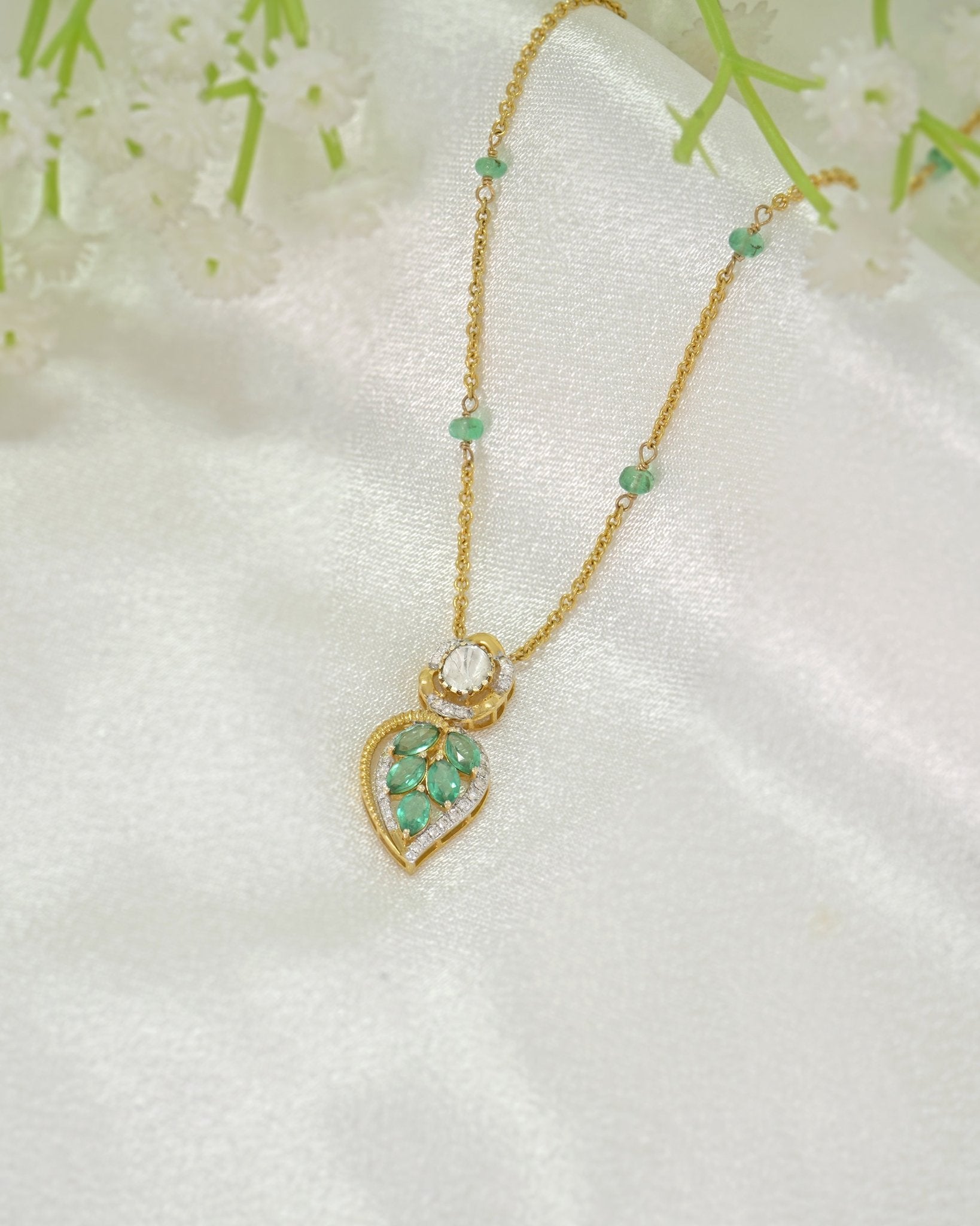 Teal Leaf Pendant in 9K gold with teal gemstone stations and a pear-cut teal drop.