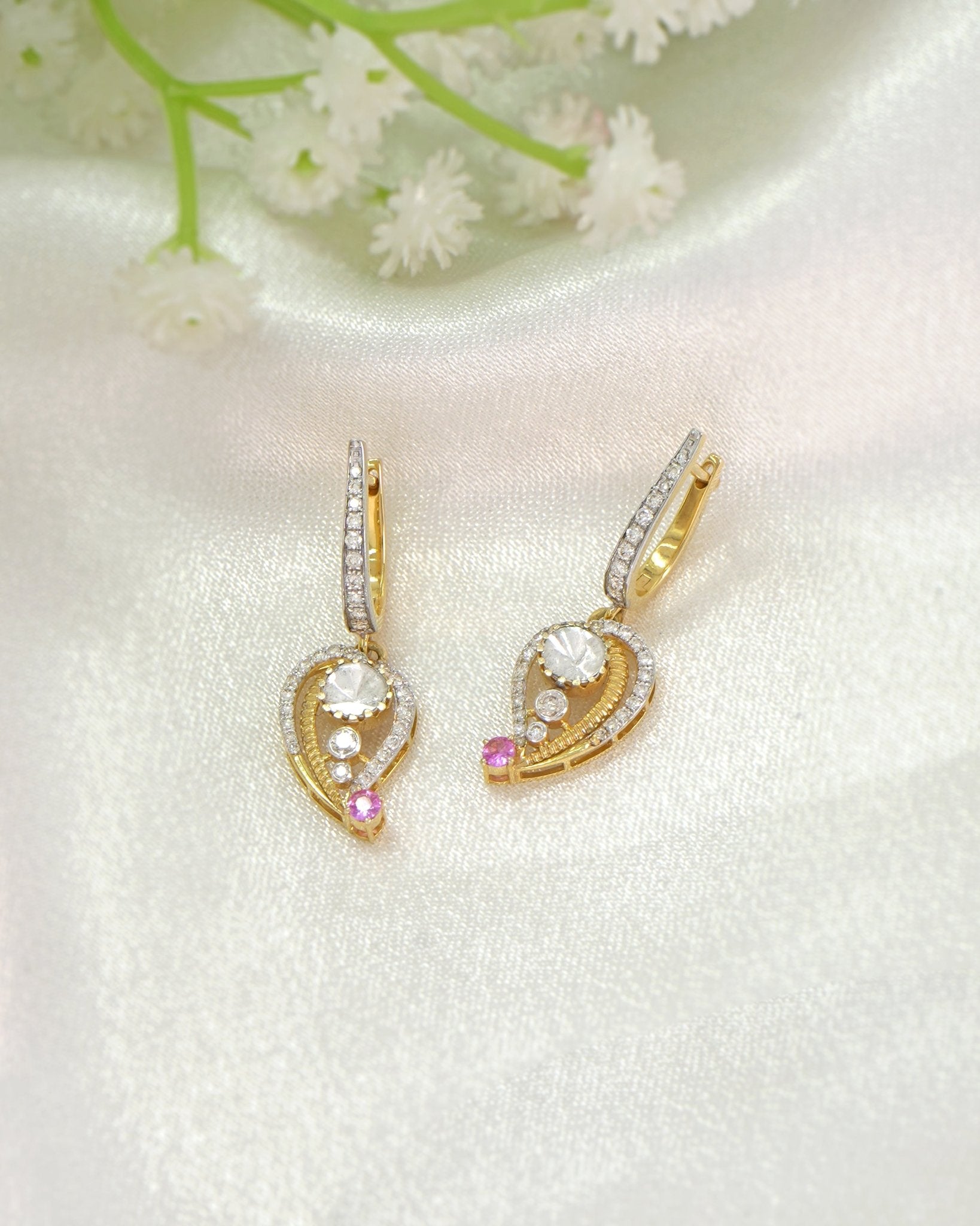 9K gold teardrop earrings with Polki detailing and delicate diamond accents.