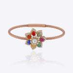 Floral bracelet with Navratna gemstones, Polki centre, diamond detailing and textured ban