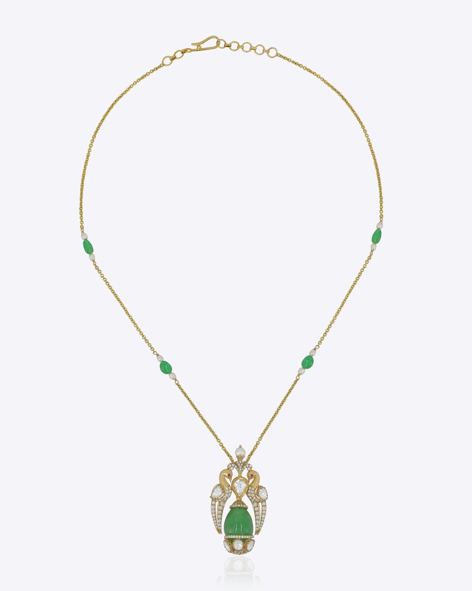 9K gold peacock pendant with a green emerald drop and diamond-set details.