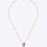 Swan Grace Pendant in 14K gold with a floral motif, uncut diamonds, and pink gemstones.