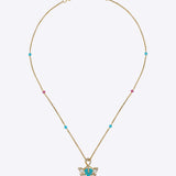 9K gold pendant with a teal enamel floral motif and Polki diamond accents