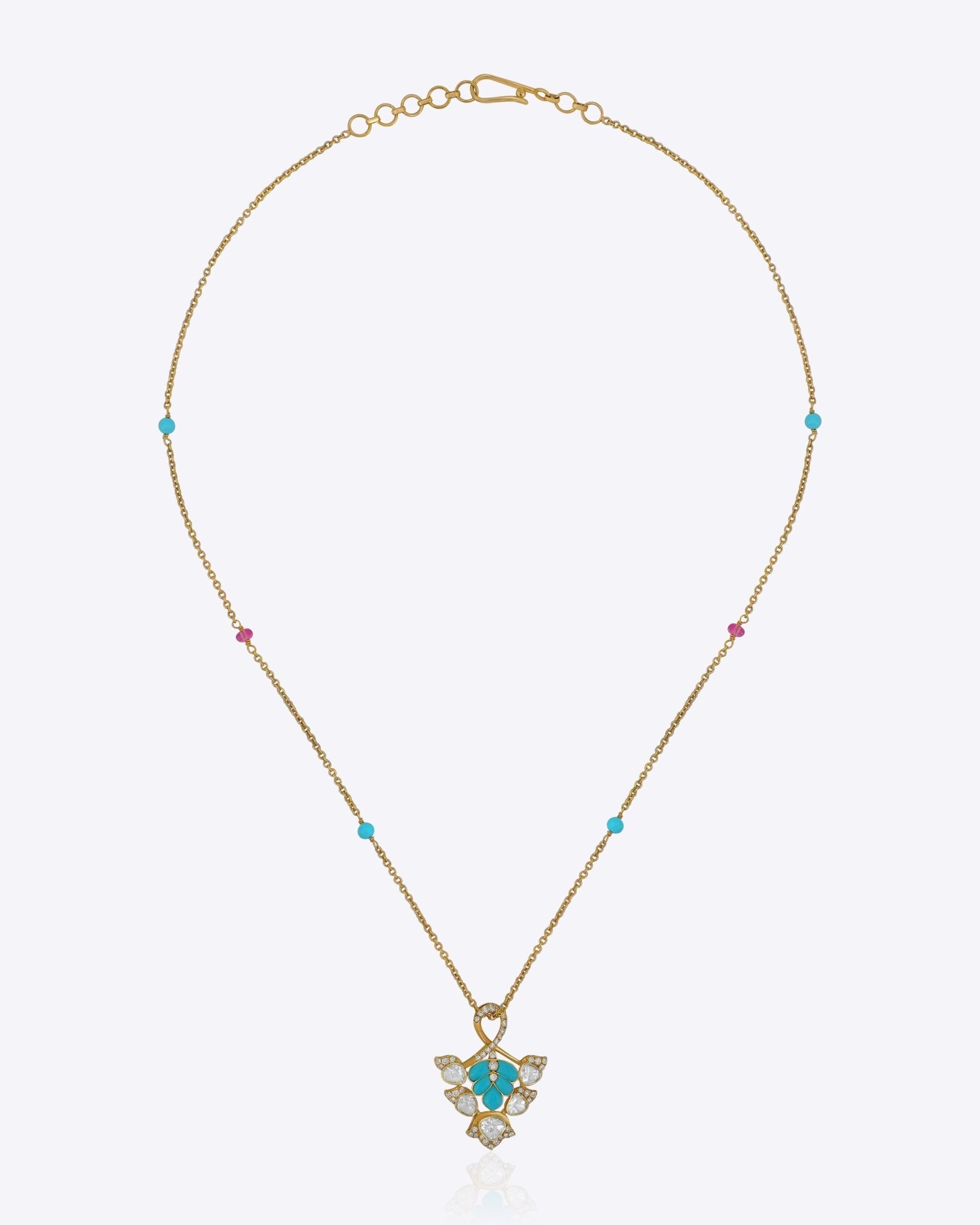 9K gold pendant with a teal enamel floral motif and Polki diamond accents