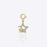 Twofold Star Charm in 14K gold featuring two radiant star motifs, one large and one small.