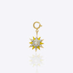 Sunshine Charm in 14K gold with golden enamel rays and a central Polki stone.
