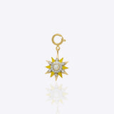 Sunshine Charm in 14K gold with golden enamel rays and a central Polki stone.