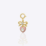 Sweetheart Bow Charm in 14K gold with a bow-tied heart and Polki accents.