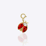 14K gold ladybug charm with Polki detailing, styled with floral charms.