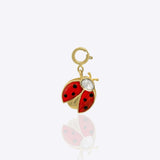 14K gold ladybug charm with Polki detailing, styled with floral charms.
