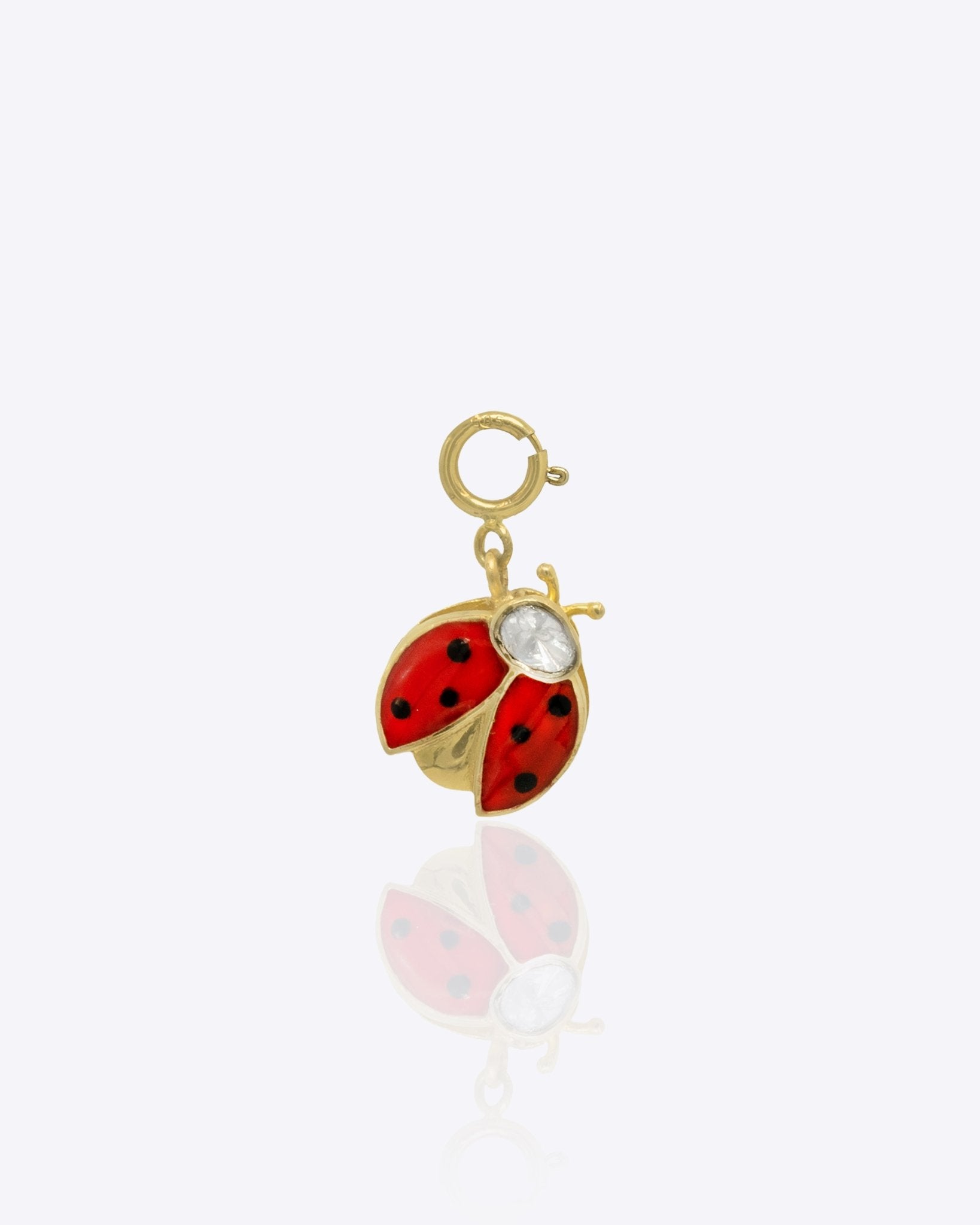 14K gold ladybug charm with Polki detailing, styled with floral charms.