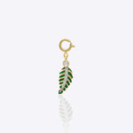 Tropical leaf charm in 14K gold with green enamel and Polki diamond detailing.