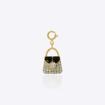 14k gold bag charm with a mix of diamonds and Polki