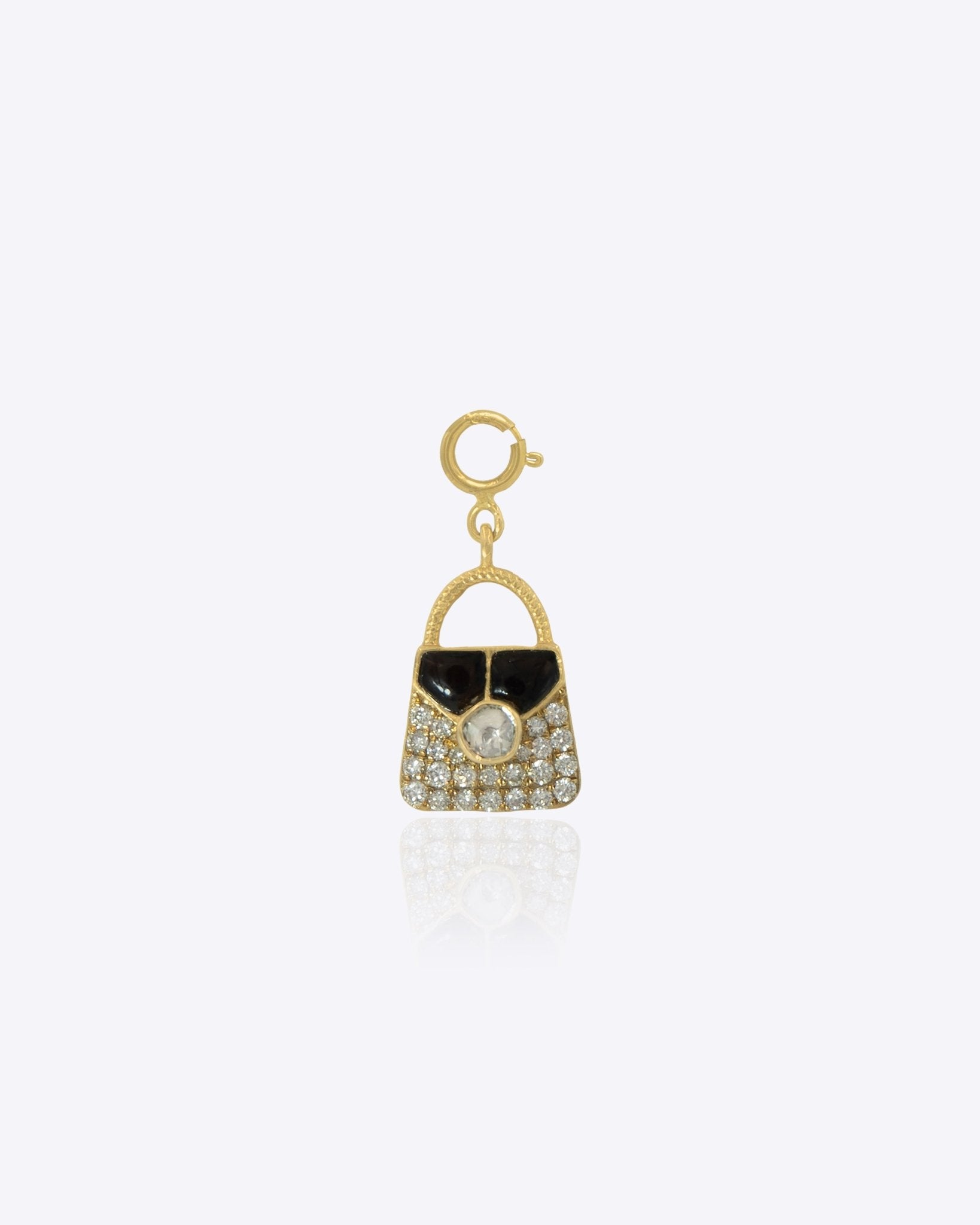 14k gold bag charm with a mix of diamonds and Polki