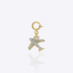14k gold airplane charm with Polki, symbolizing freedom and wanderlust