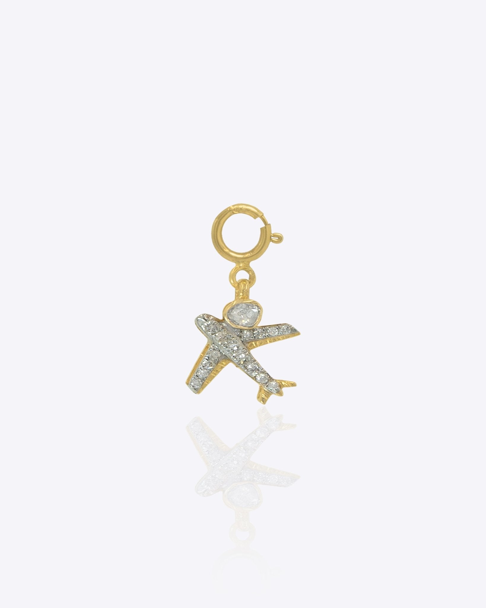 14k gold airplane charm with Polki, symbolizing freedom and wanderlust