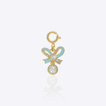 14K gold bow-shaped charm with a Polki centerpiece.