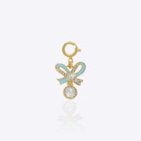 14K gold bow-shaped charm with a Polki centerpiece.