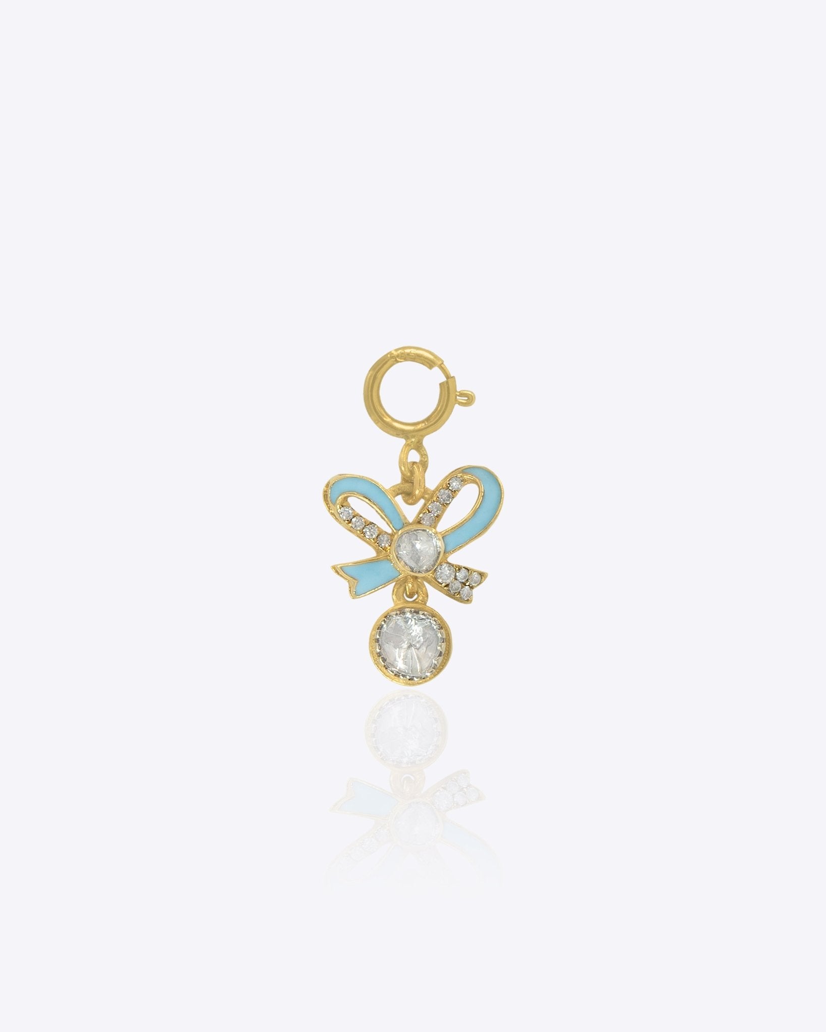 14K gold bow-shaped charm with a Polki centerpiece.