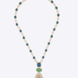 18k gold necklace uniting Polki, diamonds, morganite, and emeralds in a bold design.