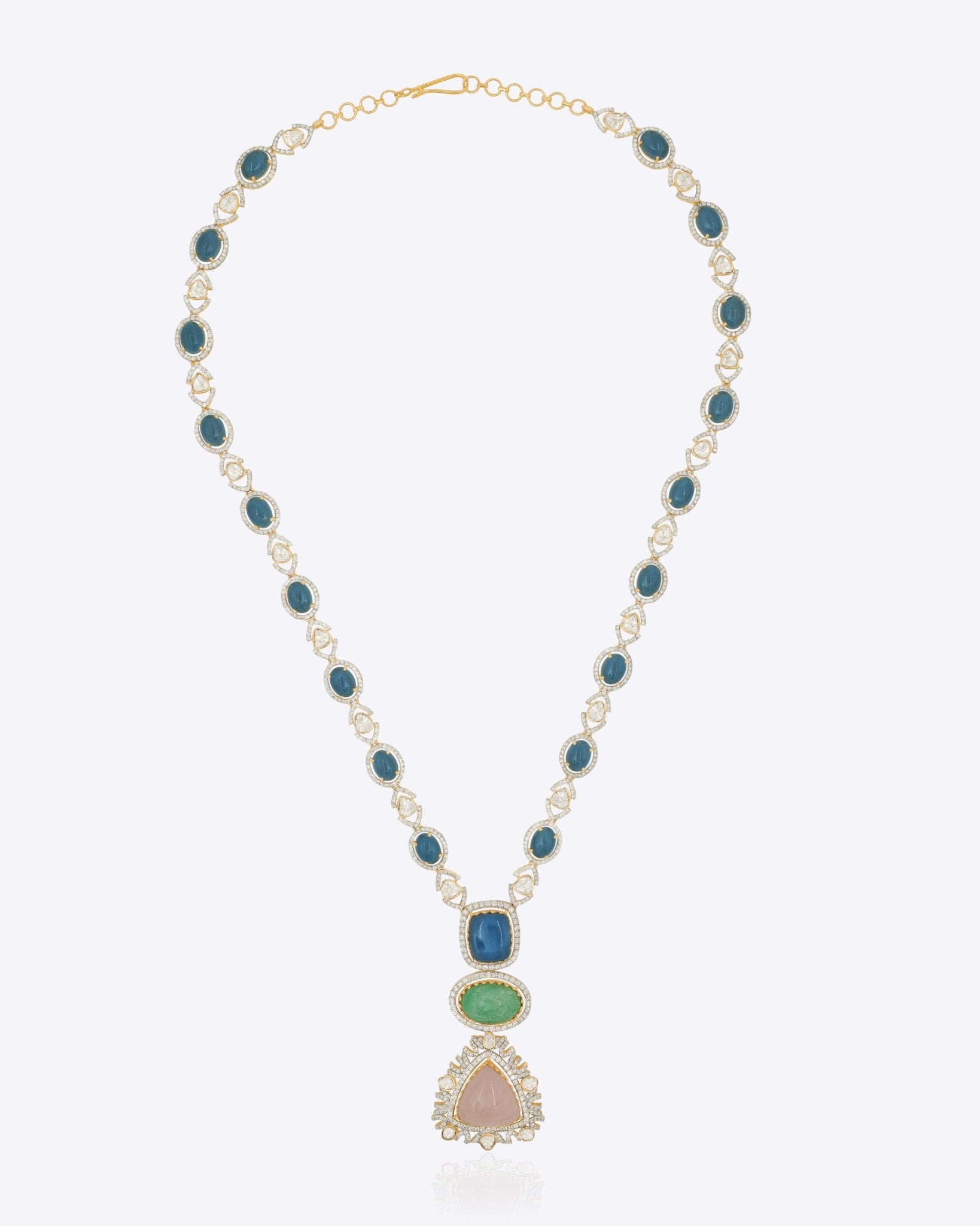 18k gold necklace uniting Polki, diamonds, morganite, and emeralds in a bold design.