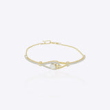 14K gold bracelet with intricate interwoven design and luminous polished finish in a modern minimalist style.