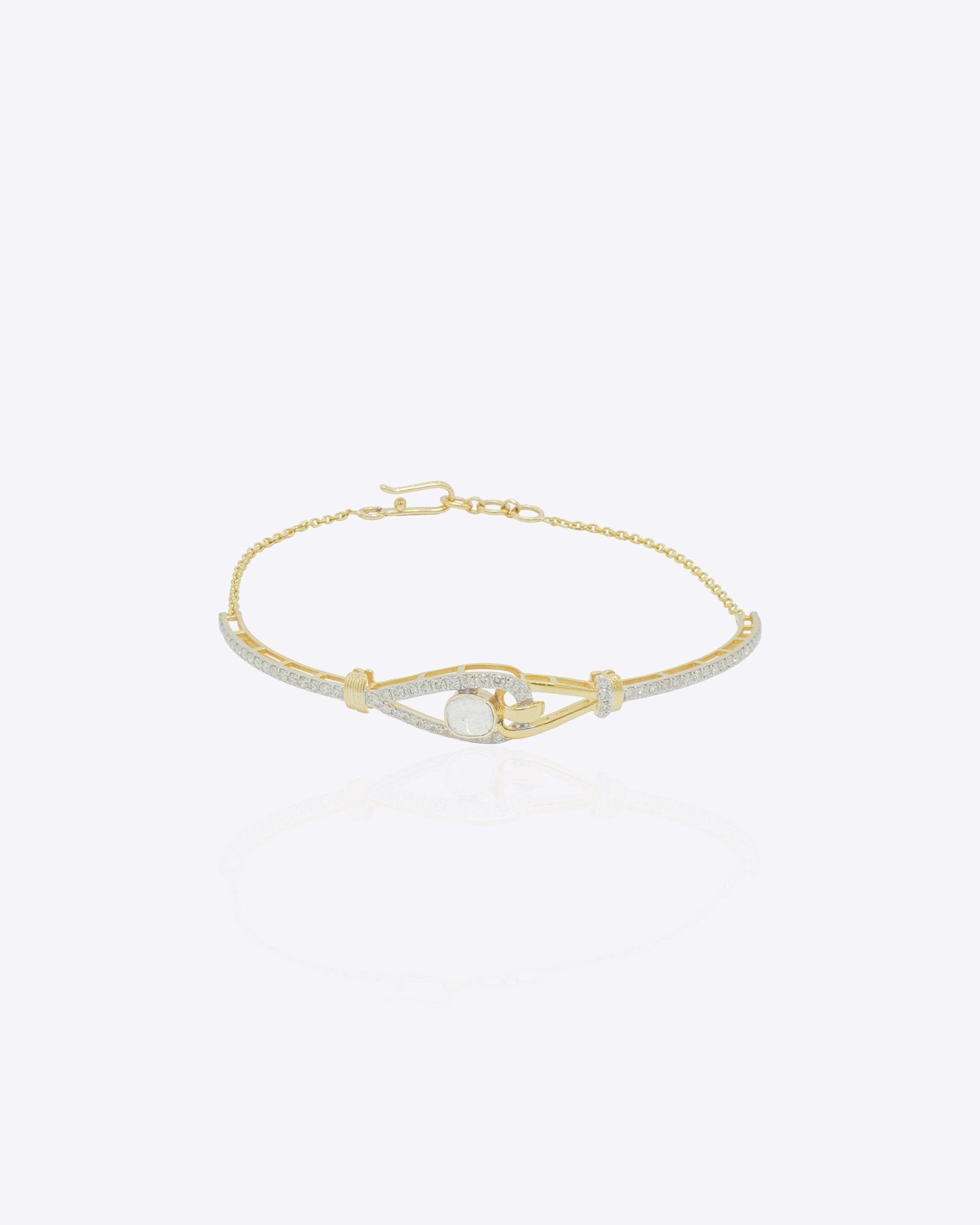 14K gold bracelet with intricate interwoven design and luminous polished finish in a modern minimalist style.