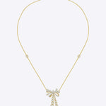 14kt gold necklace with delicate bow design and cascading drops