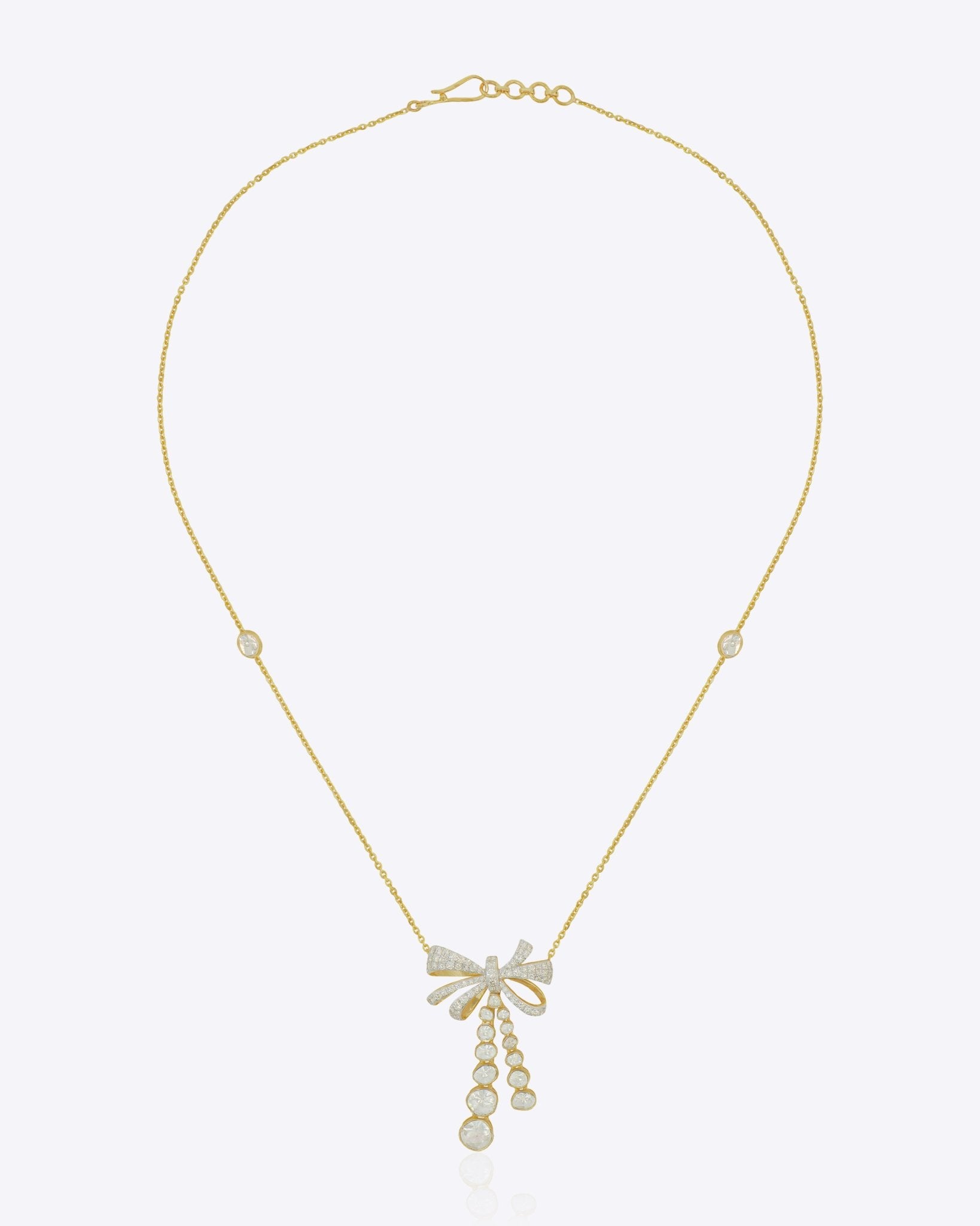 14kt gold necklace with delicate bow design and cascading drops