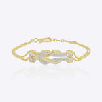 14K gold bracelet with a graceful chain and a knot of Polki diamonds.