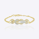 14K gold bracelet with a graceful chain and a knot of Polki diamonds.