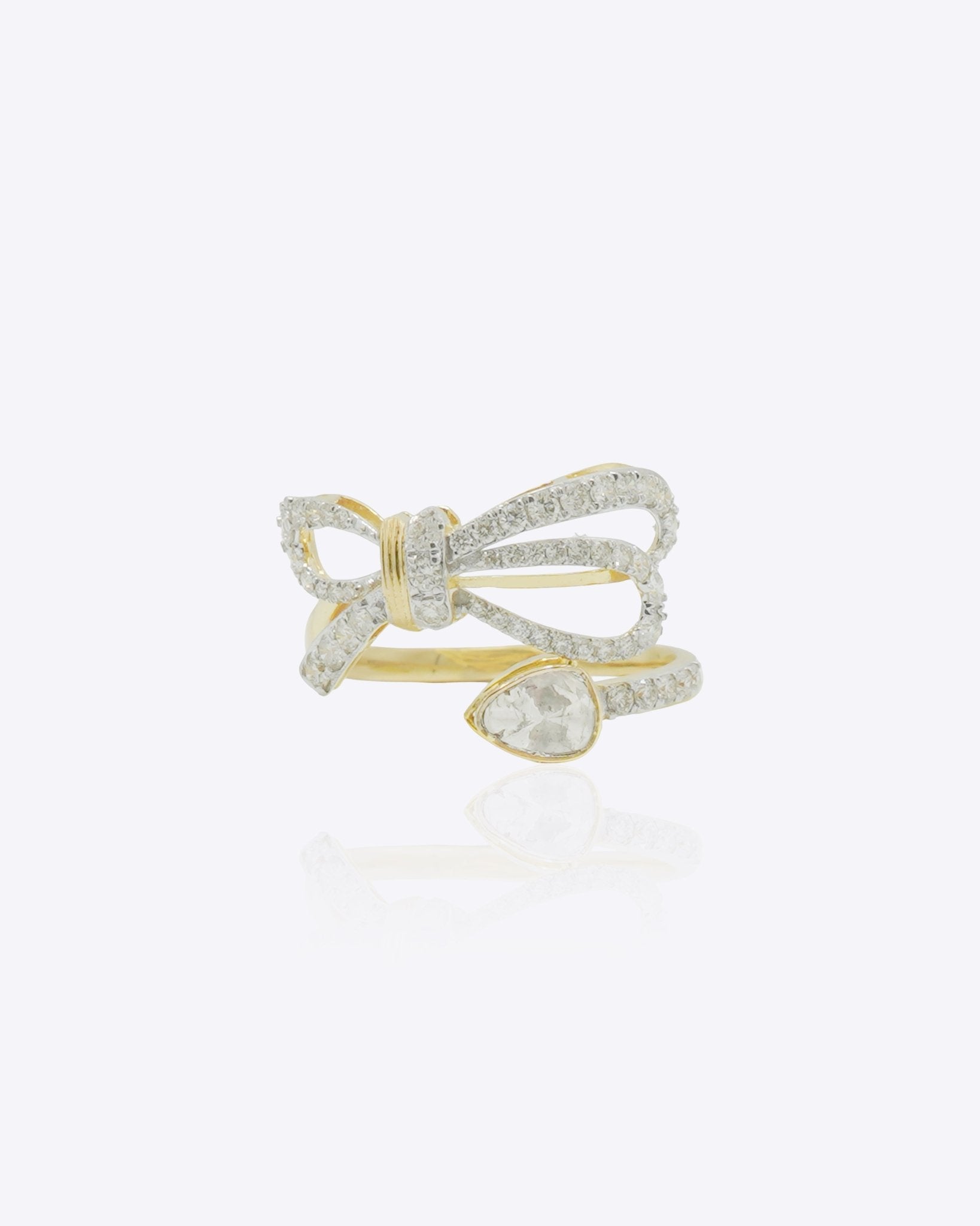 14k gold ring with a sleek, minimalist bow silhouette.