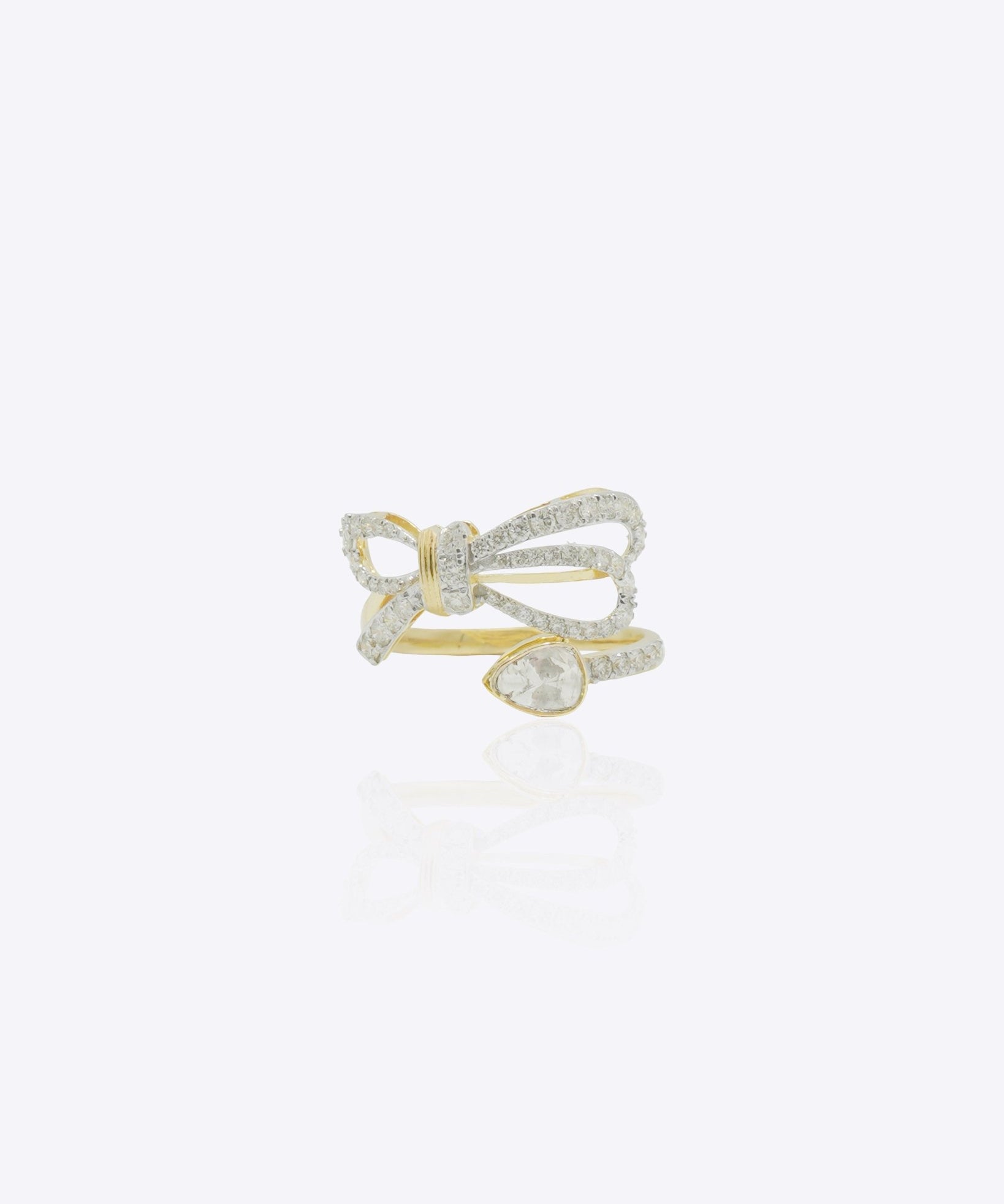 14K gold ring with a sleek ribbon-inspired bow design and refined polished finish.